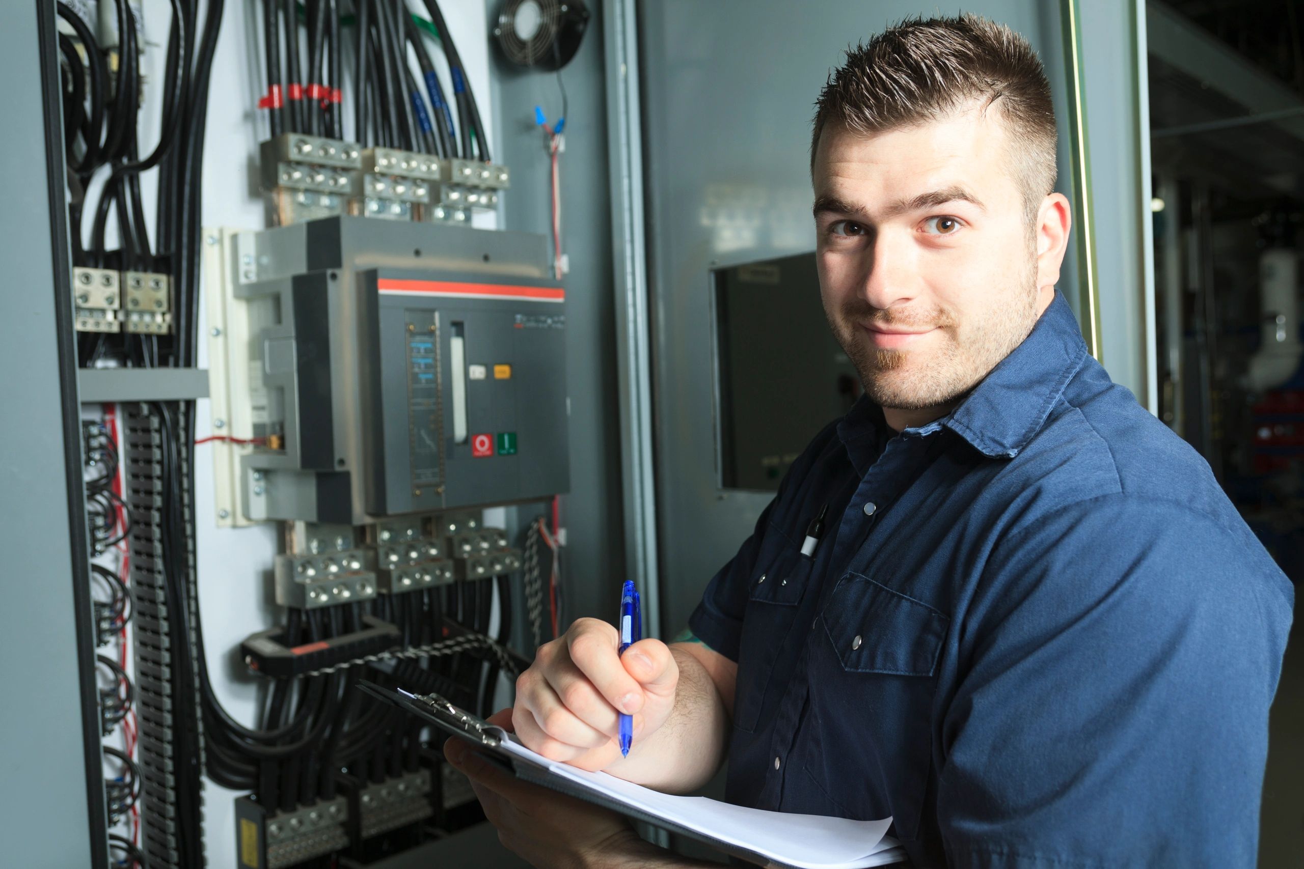Professional electrician with clipboard